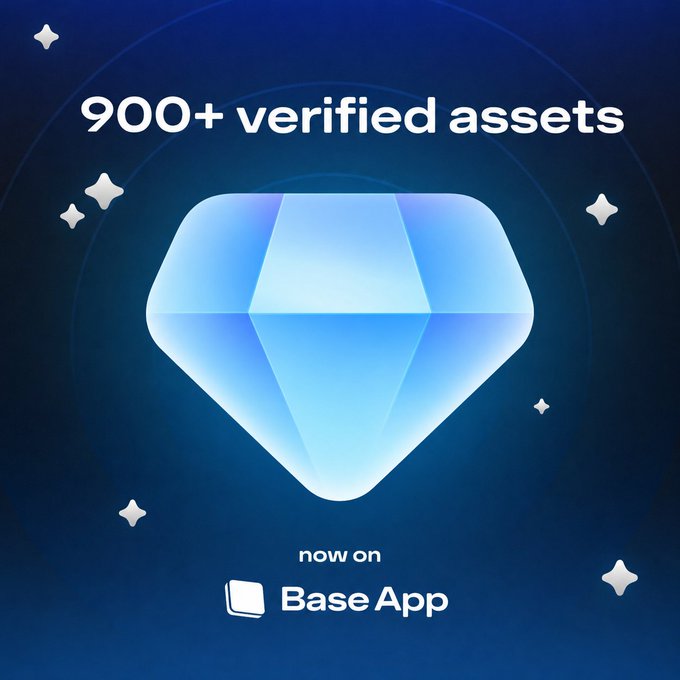 A blue promotional graphic featuring a diamond icon with the text '900+ verified assets' and 'now on Base App' against a dark background with star-like sparkles.