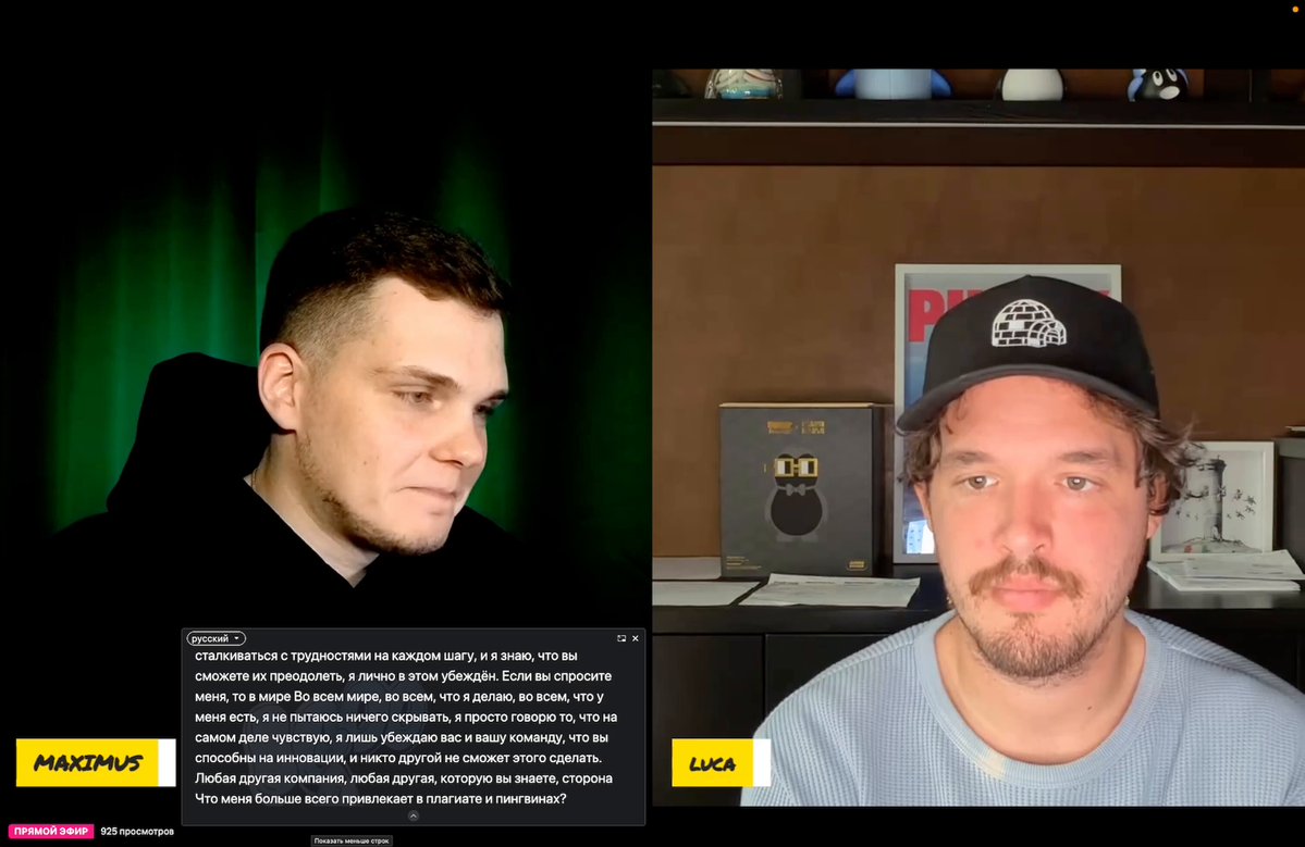 The image shows two men sitting across from each other, with a computer screen displaying their conversation. One man wears a black hat while the other has a blue shirt. The background features a brown wall with various items hanging on it. The text in the image includes phrases such as "Luca Netz just gave the most honest update on Abstract TGE ever", "@absTVx", and "@AbstractEco".