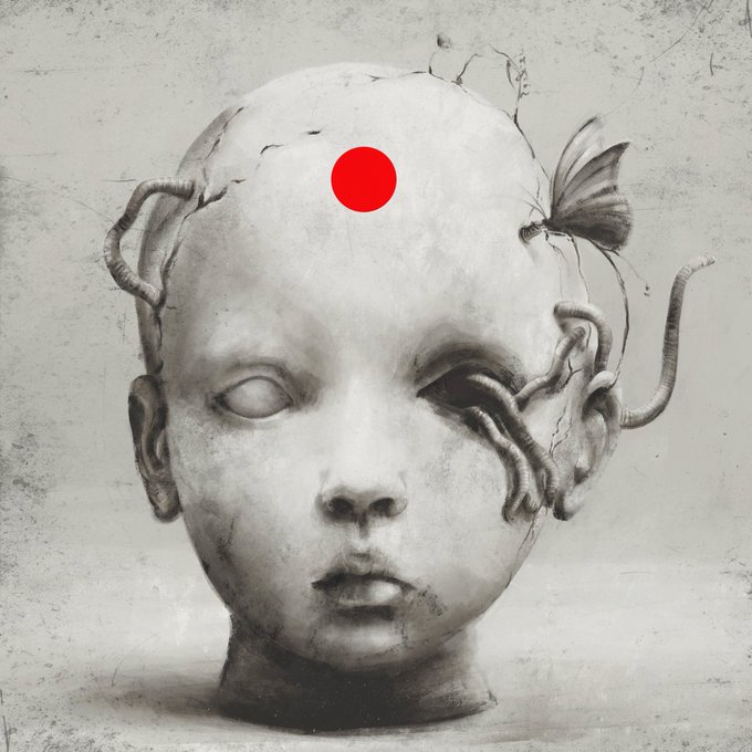 A haunting black-and-white image of a cracked doll's head with a red dot on its forehead and tendrils emerging from it.