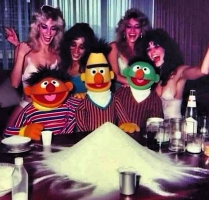A vintage-style photo shows three Sesame Street characters (Ernie, Bert, and possibly Oscar the Grouch) in striped pajamas sitting at a restaurant table with a large white powdery substance, surrounded by four 1980s-styled women posing behind them.