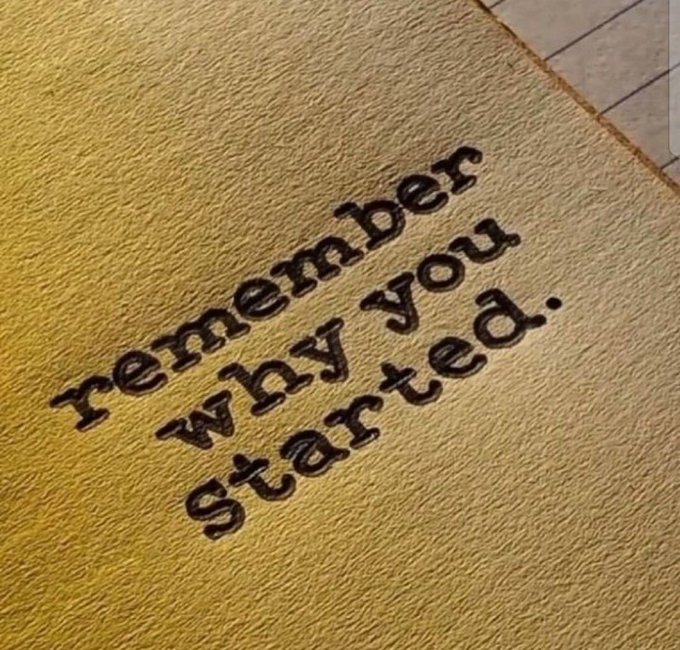 A yellow welcome mat displays the embroidered text "remember why you started." in dark brown lettering, serving as a motivational reminder that complements the post's theme about pushing through another challenging week with the encouragement to try harder.