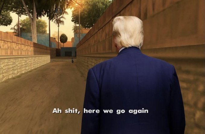 A Grand Theft Auto: San Andreas video game screenshot showing a character with Donald Trump's white hair wearing a blue suit, with the infamous meme caption 'Ah shit, here we go again' at the bottom.