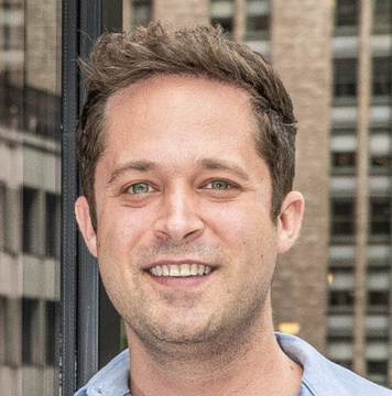 The image shows a smiling young man with short brown hair and light eyes, wearing a light blue shirt, photographed outdoors with a tall building visible in the background. The accompanying caption identifies him as Zach Brenner, who is commenting on Robinhood Chain's diverse ecosystem developments in real-world assets, stock tokens, NFTs, and memecoins.