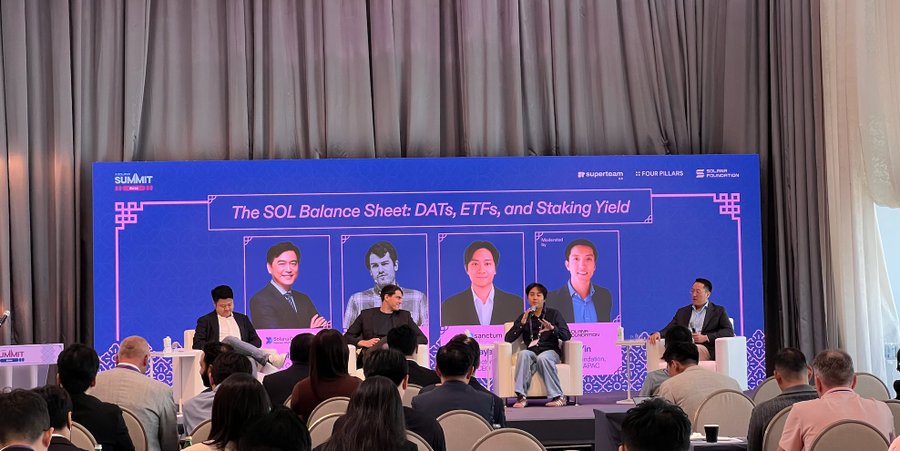 Panel discussion at the SOLANA Summit with a screen reading 'The SOL Balance Sheet: DATs, ETFs, and Staking Yield,' featuring speakers from Superteam, Four Pillars, and the Solana Foundation.