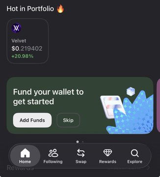 The image shows a smartphone screen displaying a wallet app called "My Portfolio" with a green background, white text, and a blue diamond shape. The app has a "Fund your wallet to get started" button at the bottom of the screen. A post on social media indicates that the user's portfolio was kept safe despite a dip in the market, and they were able to identify their token without checking through their wallet.