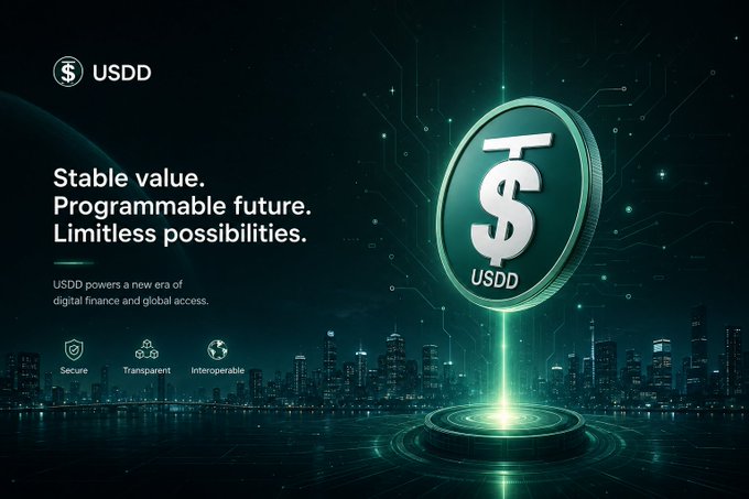 A promotional graphic for USDD cryptocurrency, featuring a large 3D dollar coin, the tagline 'Stable value. Programmable future. Limitless possibilities,' and icons for Secure, Transparent, and Interoperable features against a futuristic cityscape.