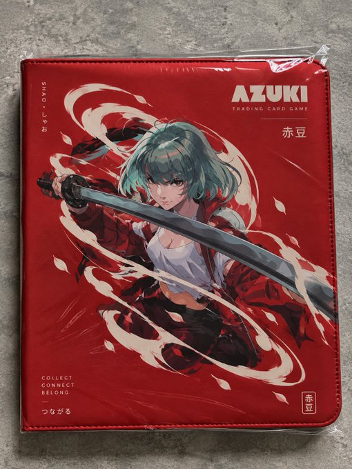 A sealed Azuki Trading Card Game box featuring anime artwork of a green-haired character wielding a sword, with the tagline "COLLECT CONNECT BELONG."