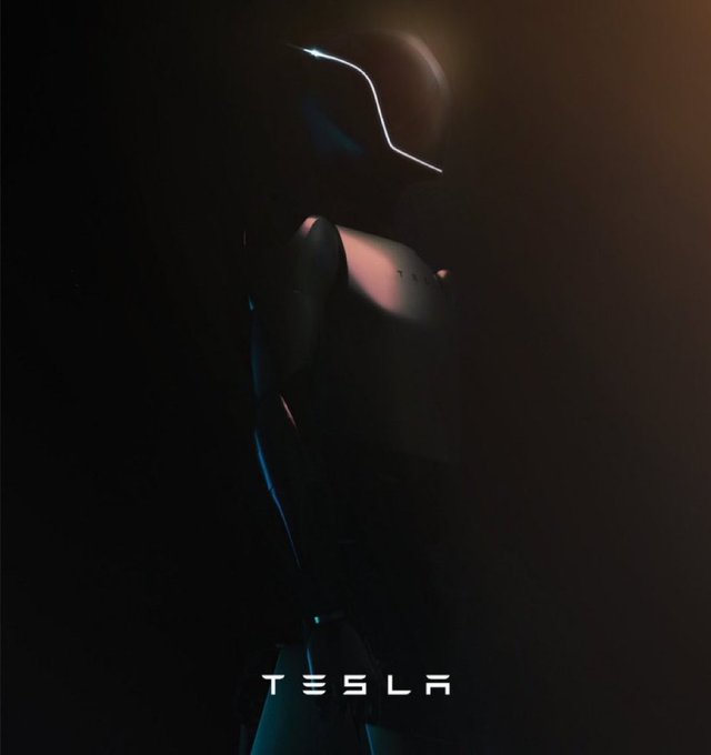 A dark teaser poster of the Tesla humanoid robot (TESLA-BOT) emerging from shadows with glowing eyes and the 'TESLA' logo at the bottom.