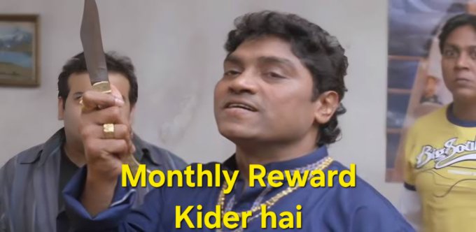 The image shows a man holding up a knife with a stern expression, flanked by two other men, with the yellow text "Monthly Reward Kider hai" overlaid on the image.

The caption humorously uses a popular meme featuring the man threateningly wielding a knife, paired with the text "Monthly Reward Kider hai" (a playful misspelling of "kider hai," suggesting rewards are coming), to playfully tease the community about the delayed distribution of monthly rewards in 12 hours.