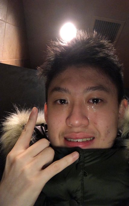 The image features a young man with short hair wearing a black jacket, making a peace sign with his fingers while looking at the camera. The caption of the photo reads "yeah I'm so good", which seems to be related to the main subject or theme of the picture.
