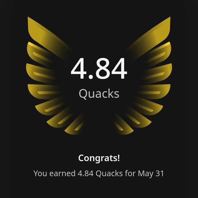 The image features an award for Quacks, which is a gold-colored trophy with a bird's wing design. The text at the bottom of the image reads "Congratulations! You earned 4.84 Quacks for May 31". This indicates that someone has achieved a specific goal or milestone in Quack-related activities and has been recognized for their accomplishment. The post seems to be promoting an online platform, possibly related to Quack culture or Quack-themed content creation.