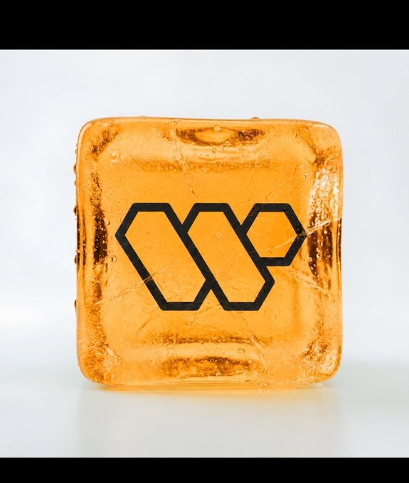 An orange-tinted ice cube features the Wallchain logo, symbolizing the cool, steady momentum and ongoing growth of the @wallchain ecosystem as new builders join and innovation expands.