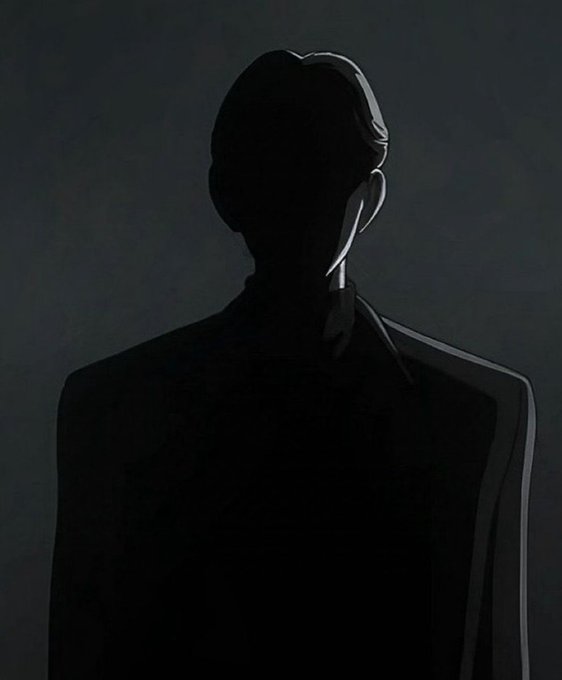 A stylized illustration of a silhouetted figure wearing a suit, with only the outline of their head and shoulders highlighted in light gray against a dark background.
