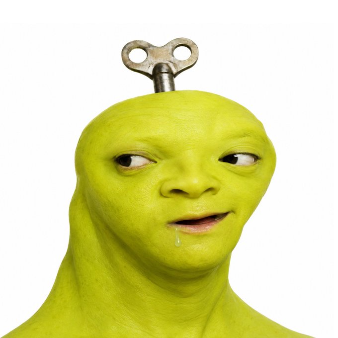 A surreal image of a green, humanoid figure with a metallic wind-up key protruding from its head, drooling while looking to the side.