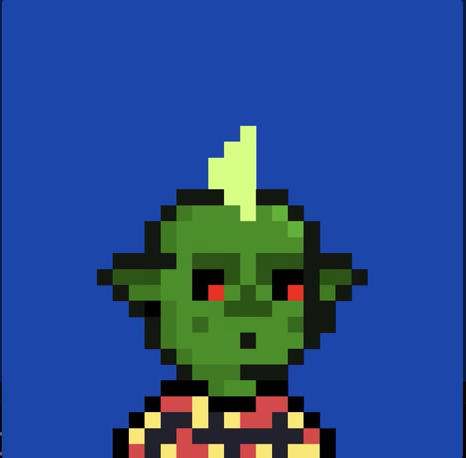 A pixel art image shows a green-skinned character with pointed ears, red eyes, and a flame-like hair tuft wearing armor against a blue background.