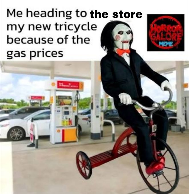 A meme showing the Billy the Puppet character from Saw riding a red tricycle at a Shell gas station, with text reading 'Me heading to the store my new tricycle because of the gas prices' and a 'Horror GALORE MEME' logo.