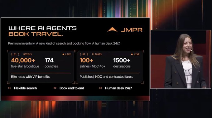 A pitch slide for JMPR reading 'WHERE AI AGENTS BOOK TRAVEL.' alongside stats for hotels and flights, with a smiling presenter visible on the right side.