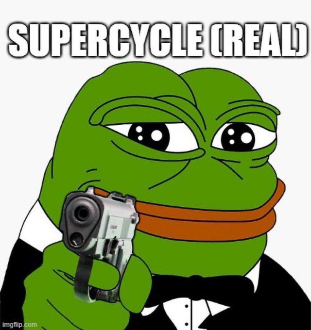 The image features a cartoon frog dressed as a man wearing a suit and tie, holding a gun. The background of the image is white with the text "Supercycle(re)real" written above the frog's head. The caption below the image reads "It's coming, and only the delusional bulls will be holding their spot $pepe when it does".