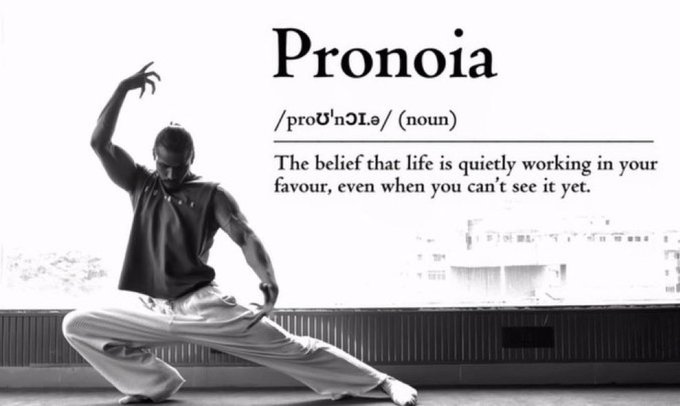 The image features a black-and-white photo of a man performing a deep lunge stretch, paired with the dictionary-style definition of "Pronoia" (pronounced "proʊˈnɔɪə"): "The belief that life is quietly working in your favour, even when you can't see it yet."

The definition ties into the motivational morning post, reinforcing the message to make the final day of September count by trusting that unseen forces are conspiring in one's favor.