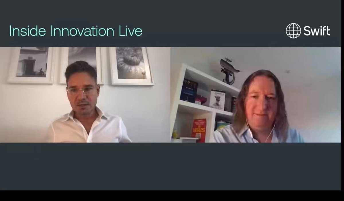 The image shows a man wearing glasses sitting next to a woman who has long hair, both of them smiling at the camera during an interview or discussion. The background features a gray wall with two framed pictures hanging above their heads. The text on the image reads "Inside Innovation Live" and "Remember: XRP and XLM were already tested." This suggests that they are discussing the latest innovations in the cryptocurrency space, specifically Bitcoin Cash (XLM), which has been widely tested and is now being used for various purposes beyond its original intent of being a digital currency.