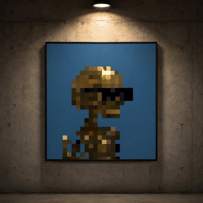 A pixelated, low-resolution portrait displayed as a framed artwork in a gallery setting, lit by an overhead spotlight, showing a figure with sunglasses against a blue background.