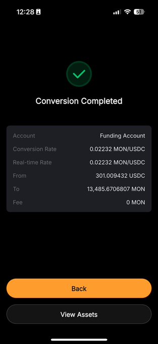 The image shows a phone screen displaying an app icon with a green checkmark, indicating that the app has been successfully purchased or used by the user. The main focus of the image appears to be the screen showing details about an account, which includes a "Funding Account" and a " Conversion Rate".