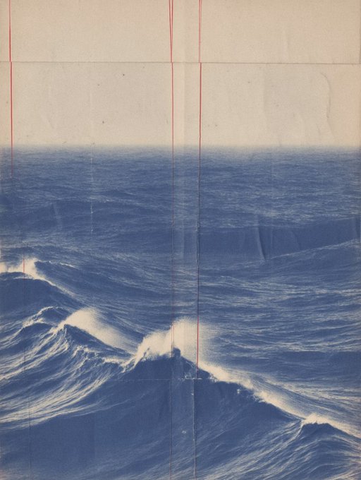 An artistic photograph of blue ocean waves with white foam crashing against a pale sky, featuring vertical red lines reminiscent of Japanese shibori or vintage photo printing artifacts.