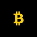 A glowing yellow Bitcoin logo on a black background.