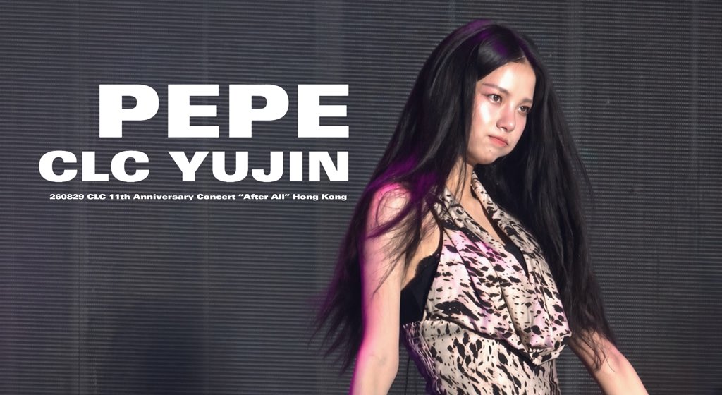 A concert photo with text 'PEPE CLC YUJIN 260829 CLC 11th Anniversary Concert "After All" Hong Kong' showing a performer with long black hair in a patterned halter outfit on stage.