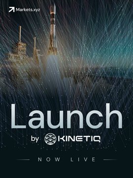 In this image, we see a promotional poster for a launching event. The main focus of the poster is a rocket ship flying above some buildings with clouds. There are also two TVs placed around the scene, one on the left side of the image and another towards the bottom right corner. The text at the top of the poster indicates that this launch is happening "NOW LIVE". In addition to the rocketship and building elements in the background, there's a logo visible on the poster which represents Kinetix.