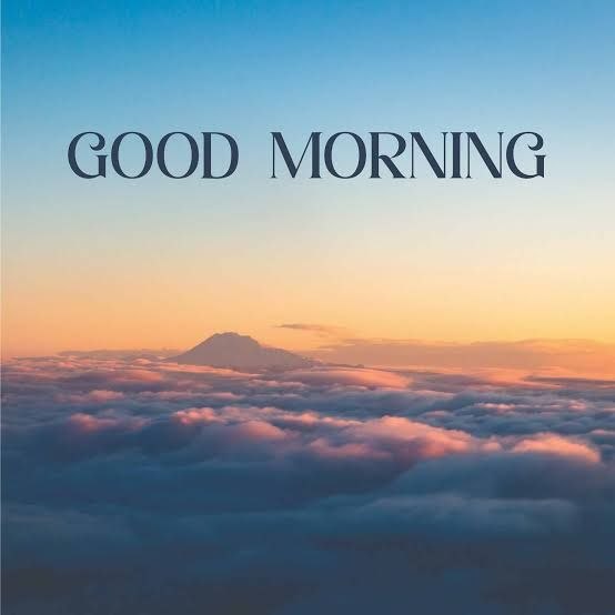 A scenic image of clouds at sunrise/sunset with a mountain peak visible in the distance, overlaid with the text 'GOOD MORNING' in elegant serif font.