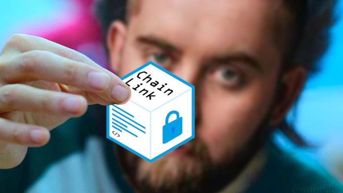 A close-up photo of a bearded man holding a cube-shaped graphic labeled 'ChainLink' featuring a padlock icon, with the watermark '@waihin_' in the corner.