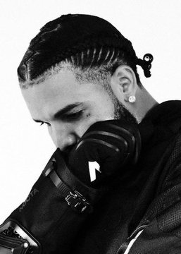 A black-and-white close-up of the rapper Drake, with his head bowed and braided hair visible, wearing a black face mask and a leather jacket, complements the post's Polymarket prediction about the odds of him releasing a new album.