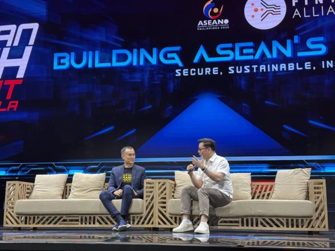 Two men sit on a stage at an ASEAN event, with a large screen behind them displaying 'BUILDING ASEAN'S FUTURE' and 'SECURE, SUSTAINABLE' under the ASEAN Philippines 2025 logo.