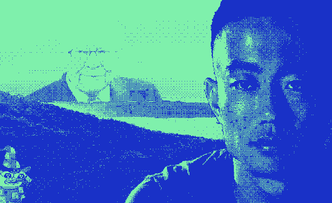 A stylized blue and cyan filtered image showing a man in the foreground with what appears to be another person in the background.