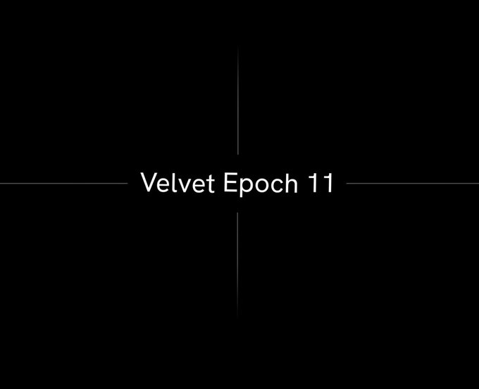 A black screen displays the text 'Velvet Epoch 11' centered between thin crosshair lines.