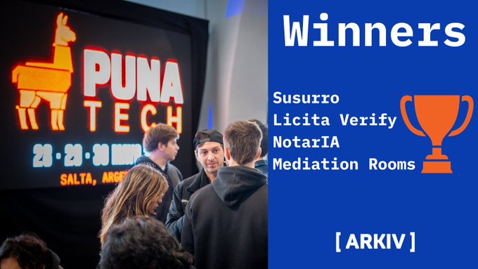 The image features a group of people standing around each other near a blue sign that says "Winners" at the top, and a poster for Puna Tech with an orange trophy displayed underneath. The text "If you'r looking for inspiration this week check out the winners of the AI tracks at Puna Tech, Salta - building with @arkivnetwork Repos and demos in the thread below". This suggests that there might be some sort of competition or event related to artificial intelligence (AI) happening at Puna Tech. The people standing around could be participants, judges, or organizers of the event who have just won an AI track competition.