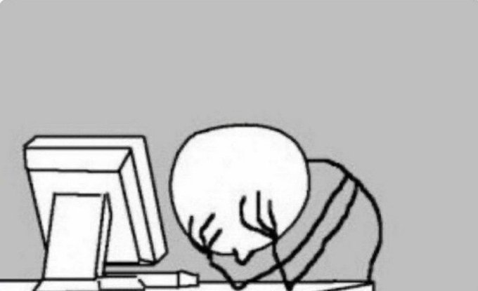 A simple black and white line drawing shows a bald person sitting at a desk, head in hands, in front of a computer monitor, expressing frustration or despair.