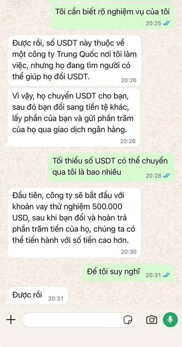 A WhatsApp conversation in Vietnamese where someone explains a job offer involving transferring 500,000 USDT, converting it to another currency, and sending a percentage back via bank transaction—matching the post about receiving 500k USDT with a percentage bonus, which appears to be a common cryptocurrency scam.