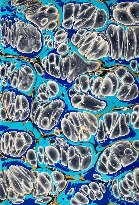 An abstract marbled pattern featuring swirling organic shapes in shades of gray, white, and vibrant blue with subtle gold accents.