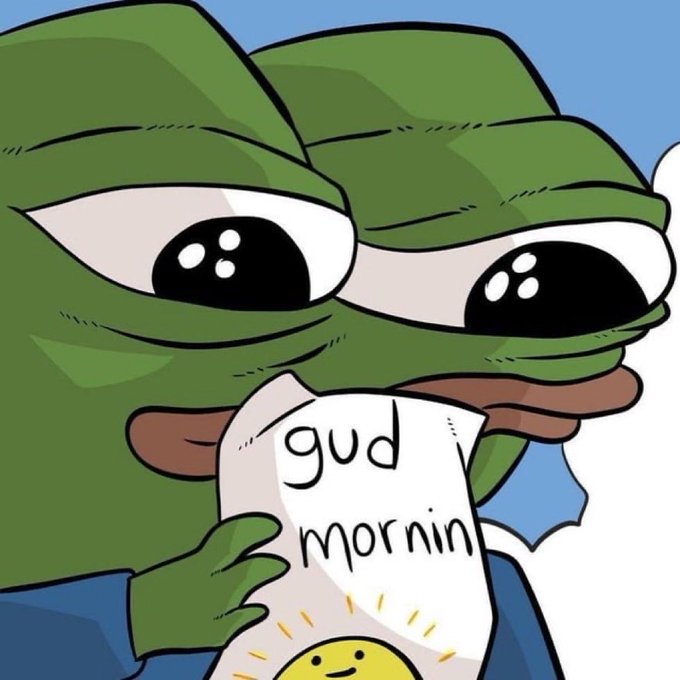 A cartoon illustration of the Pepe the Frog character holding a piece of paper that reads "gud mornin" with a drawing of a smiling sun.
