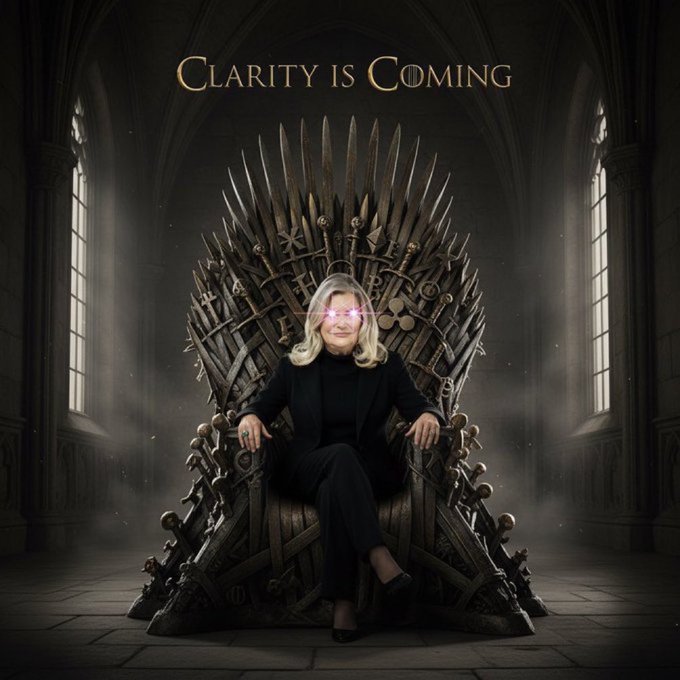 A woman with blonde hair and glowing purple eyes sits on a throne made of swords in a dark hall; the text 'CLARITY IS COMING' is displayed at the top.