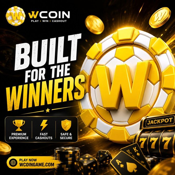 A bold promotional graphic for WCOIN featuring a large golden "W" casino chip alongside dice, playing cards (Aces and Kings), slot reels showing "777," and a "JACKPOT" sign, with the headline "BUILT FOR THE WINNERS" and supporting badges for "PREMIUM EXPERIENCE," "FAST CASHOUTS," and "SAFE & SECURE," directing viewers to play at WCOINGAME.com—visually reinforcing the post's message of a player-focused crypto gaming platform.