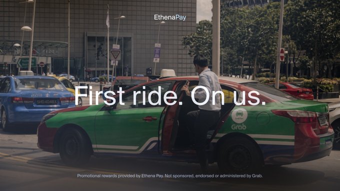 Promotional image for EthenaPay showing a man entering a green Grab taxi with the text 'First ride. On us.' and noting promotional rewards are provided by Ethena Pay, not Grab.