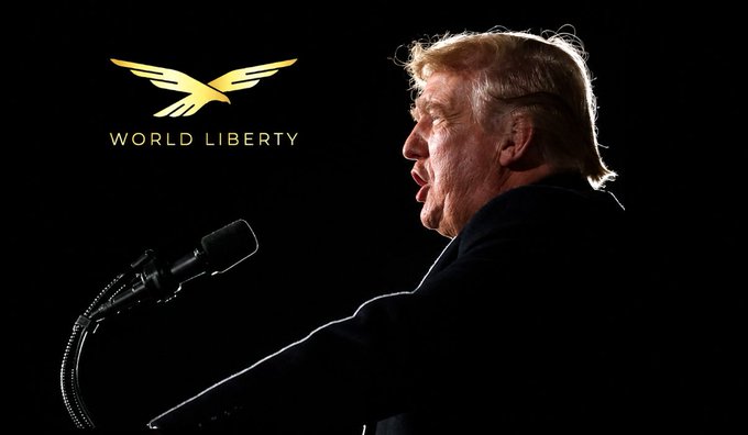 Donald Trump speaks at a podium in profile view, with the "WORLD LIBERTY" logo (featuring a gold eagle emblem) displayed in the upper left corner of the image, directly tying to his World Liberty Financial crypto venture mentioned in the post about his billion-dollar crypto gains.