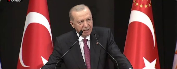 Turkish President Recep Tayyip Erdoğan speaks at a podium flanked by Turkish flags, with the location marker '▼ ANKARA' in the top left corner.