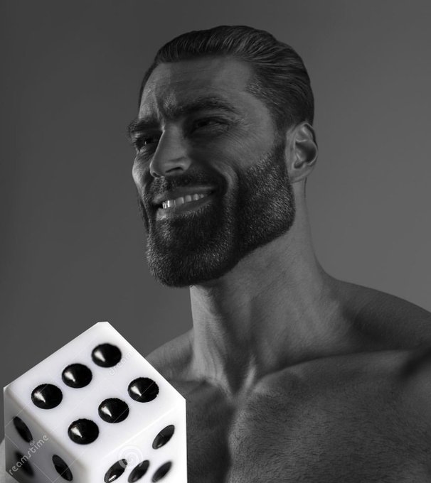 A black-and-white portrait shows a smiling, bearded shirtless man holding a large white die with black dots showing various numbers.