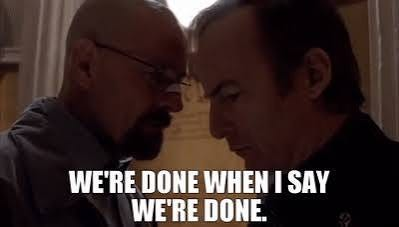 The image shows two men in a tense close-up standoff, with bold white text reading "WE'RE DONE WHEN I SAY WE'RE DONE." above them. The aggressive, authoritative scene reflects the post's confident declaration about entering a new bullish phase in crypto following a pullback, reinforcing the message that the downturn is over and higher prices are imminent.