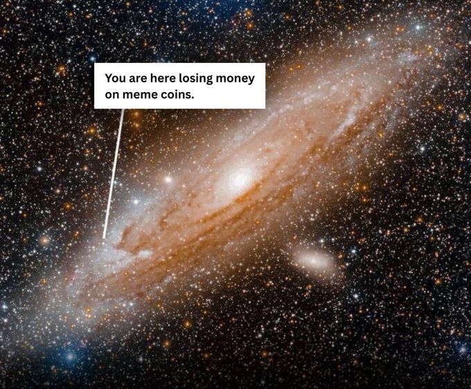 A cosmic meme pointing to a tiny dot on the Andromeda Galaxy with the text 'You are here losing money on meme coins.'