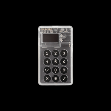 A transparent cold wallet device with a numeric keypad (1-9, 0, and function buttons) is displayed against a black background, featuring the text "Coldcard" on its exposed circuit board. The image illustrates the Coldcard hardware wallet referenced in the article about a security exploit causing Bitcoin holders to seek safer storage alternatives.